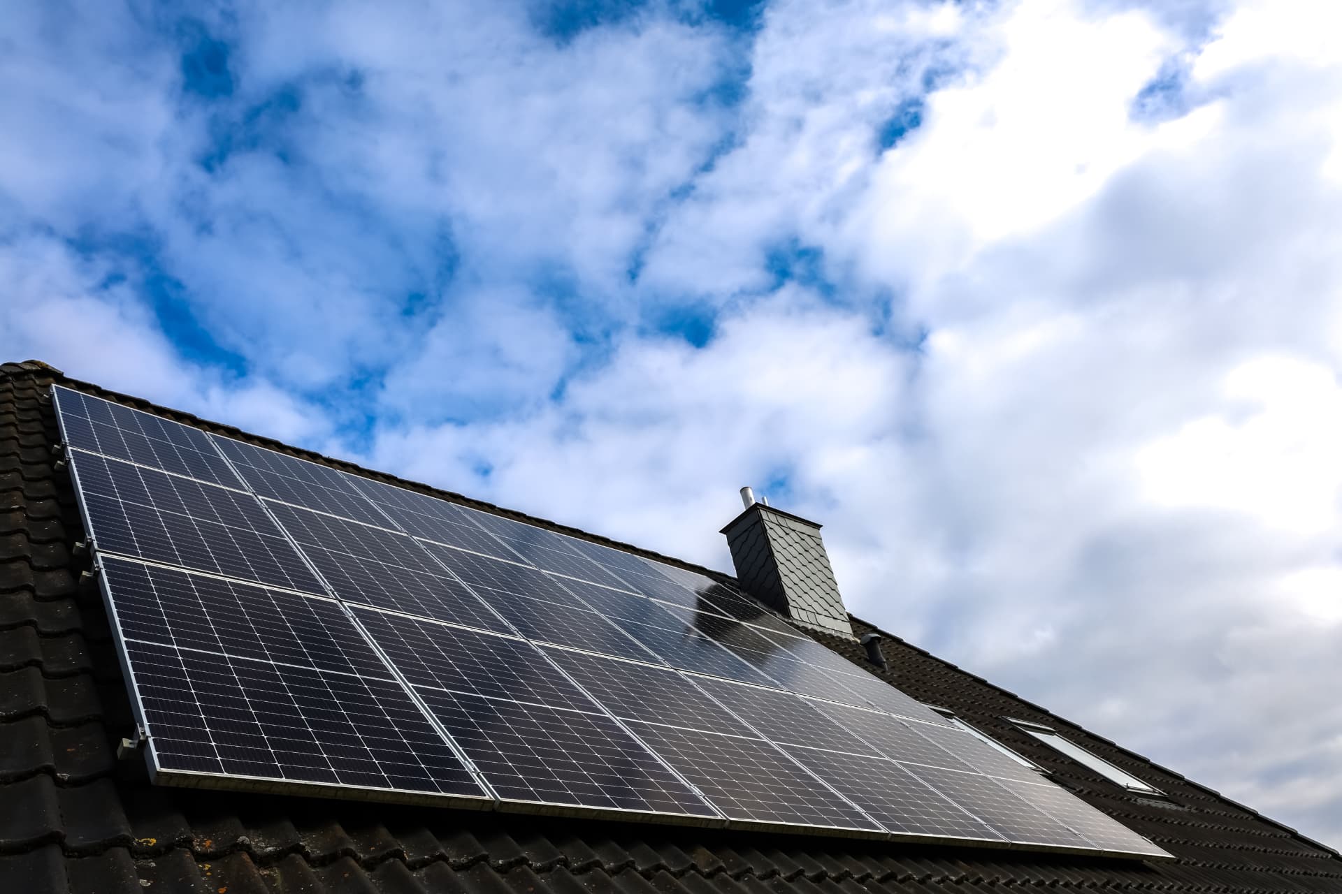 Roof-mounted solar PV panel array installed on a tiled domestic roof