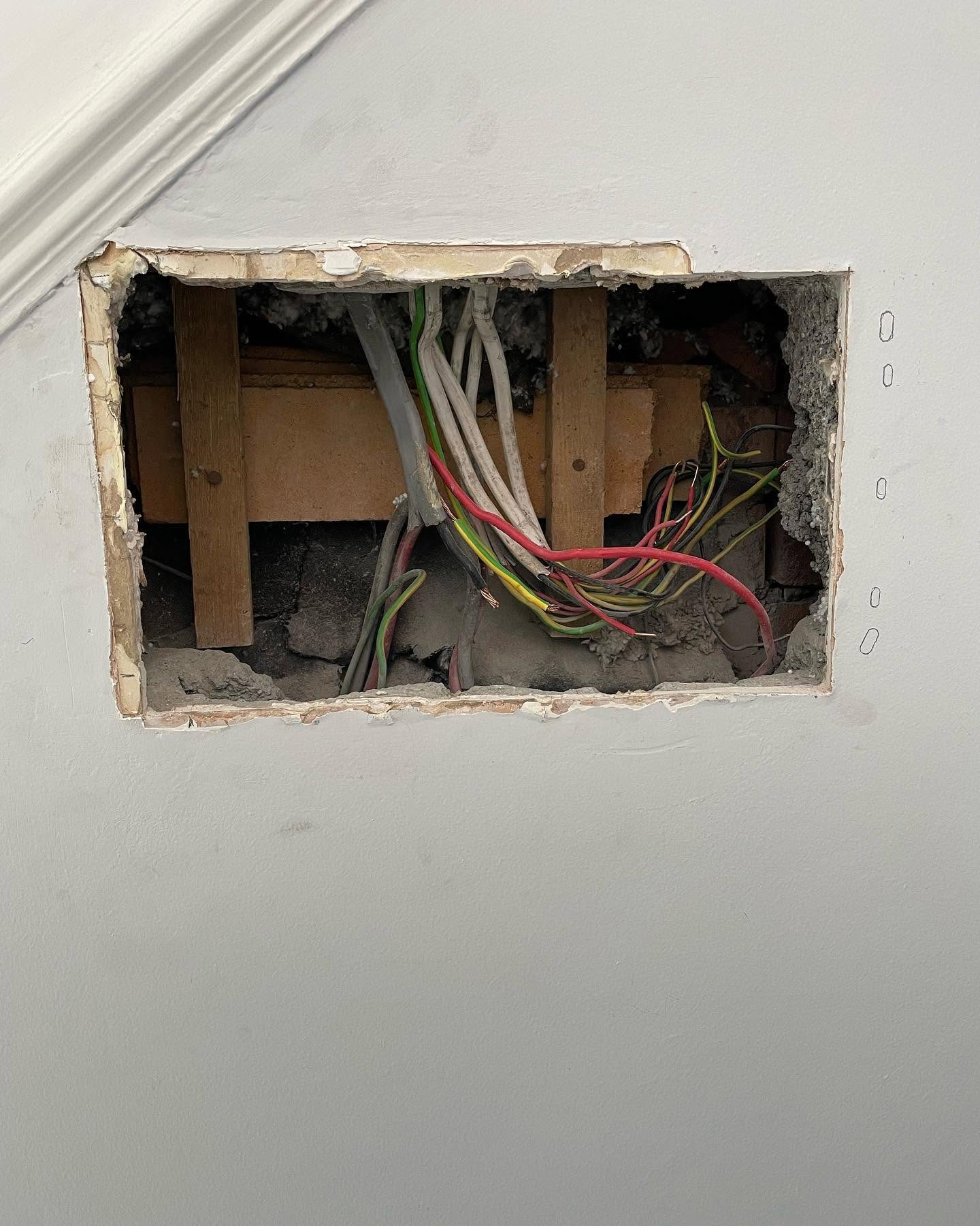 Chased wall opening showing cabling routed during a full house rewire