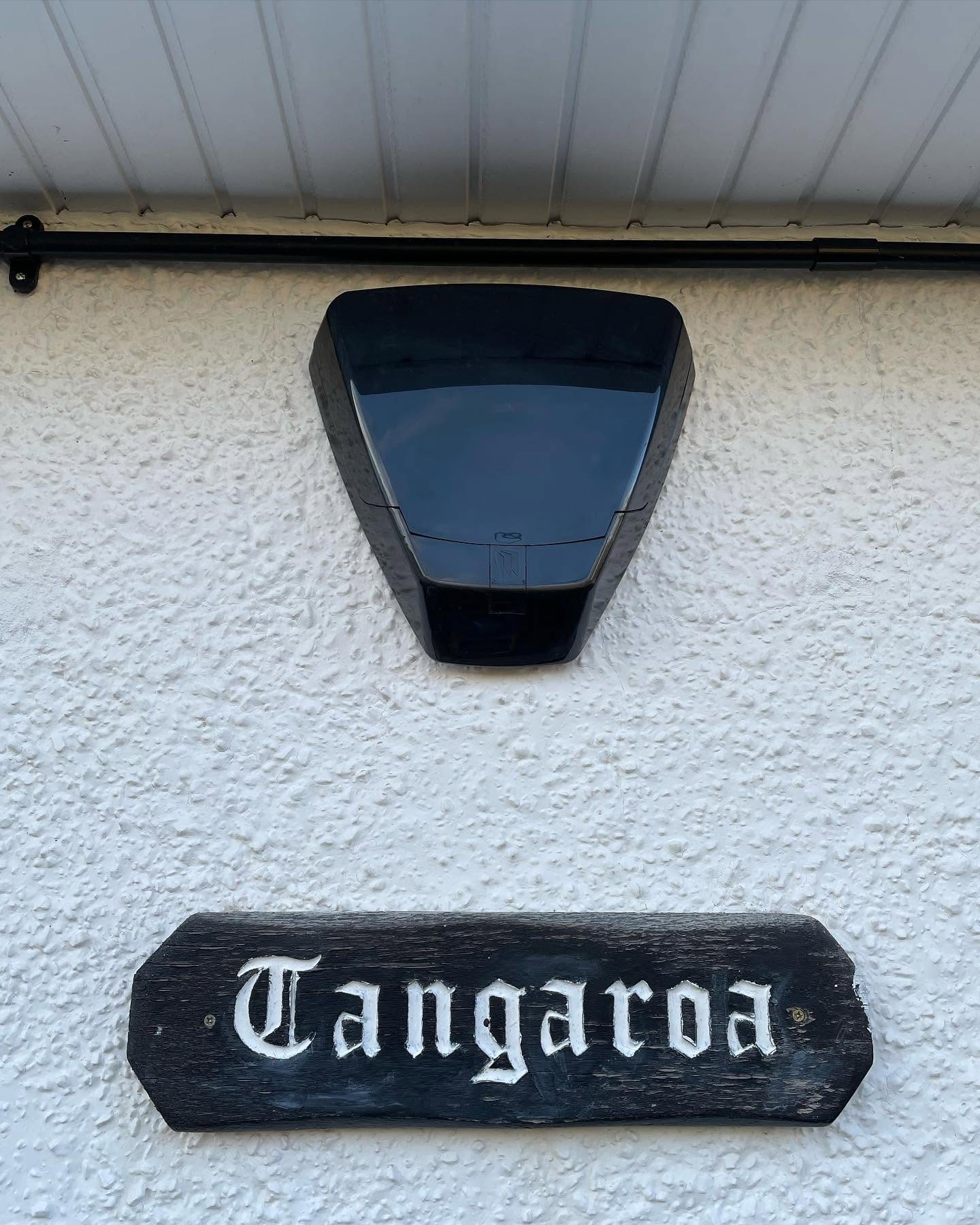 External intruder alarm sounder installed on the front wall of a house