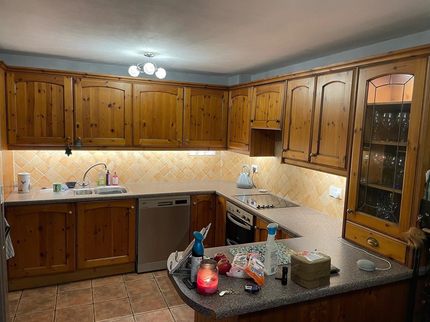 Traditional wooden kitchen with under-cupboard lighting after electrical work