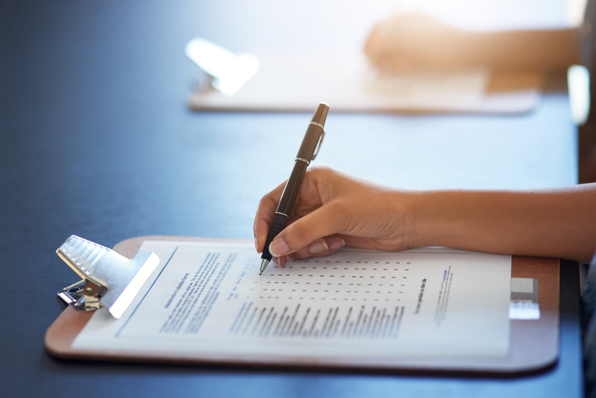 Free security and electrical survey checklist being completed on a clipboard