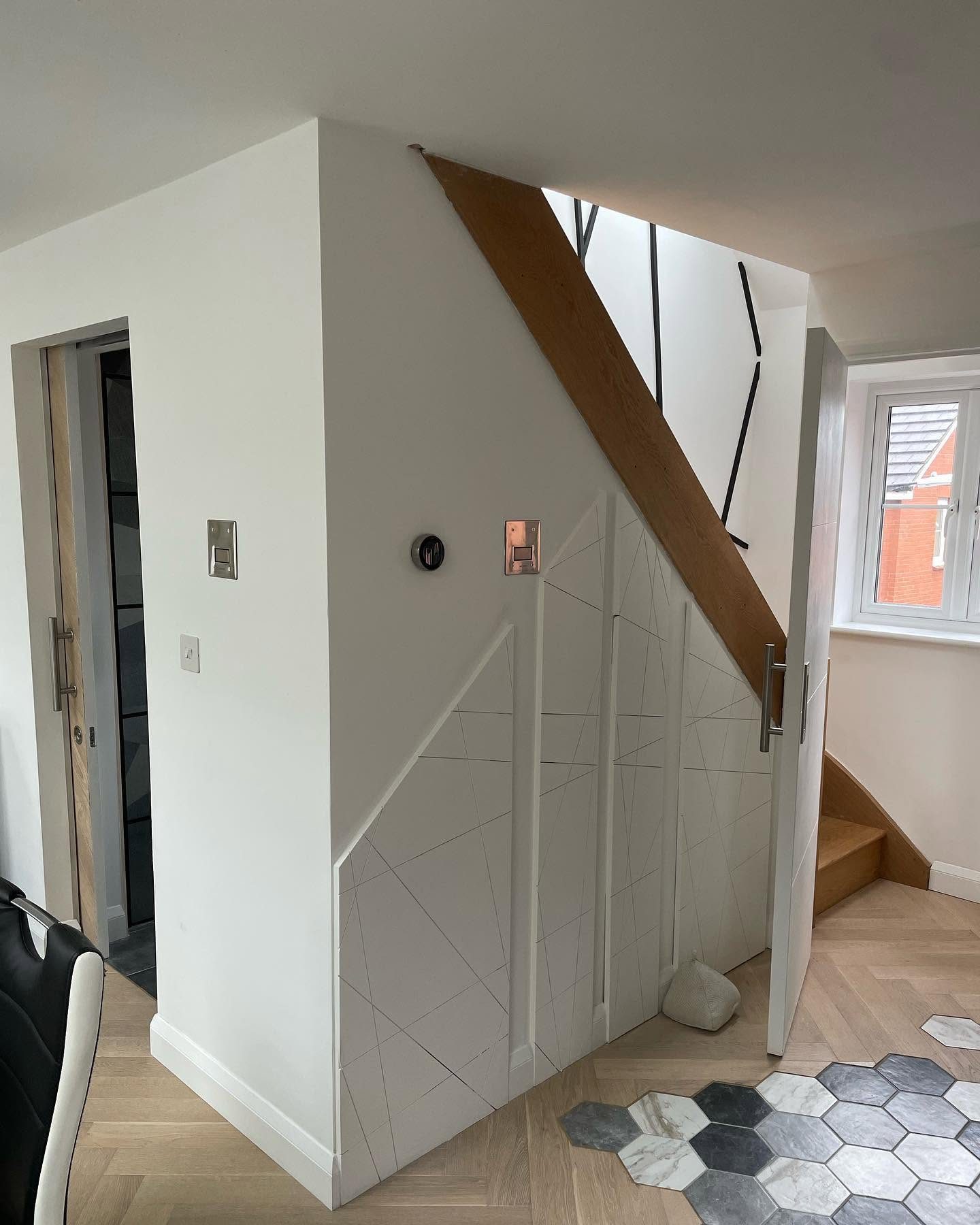 Decorative switches and lighting installed in a modern hallway and stairway