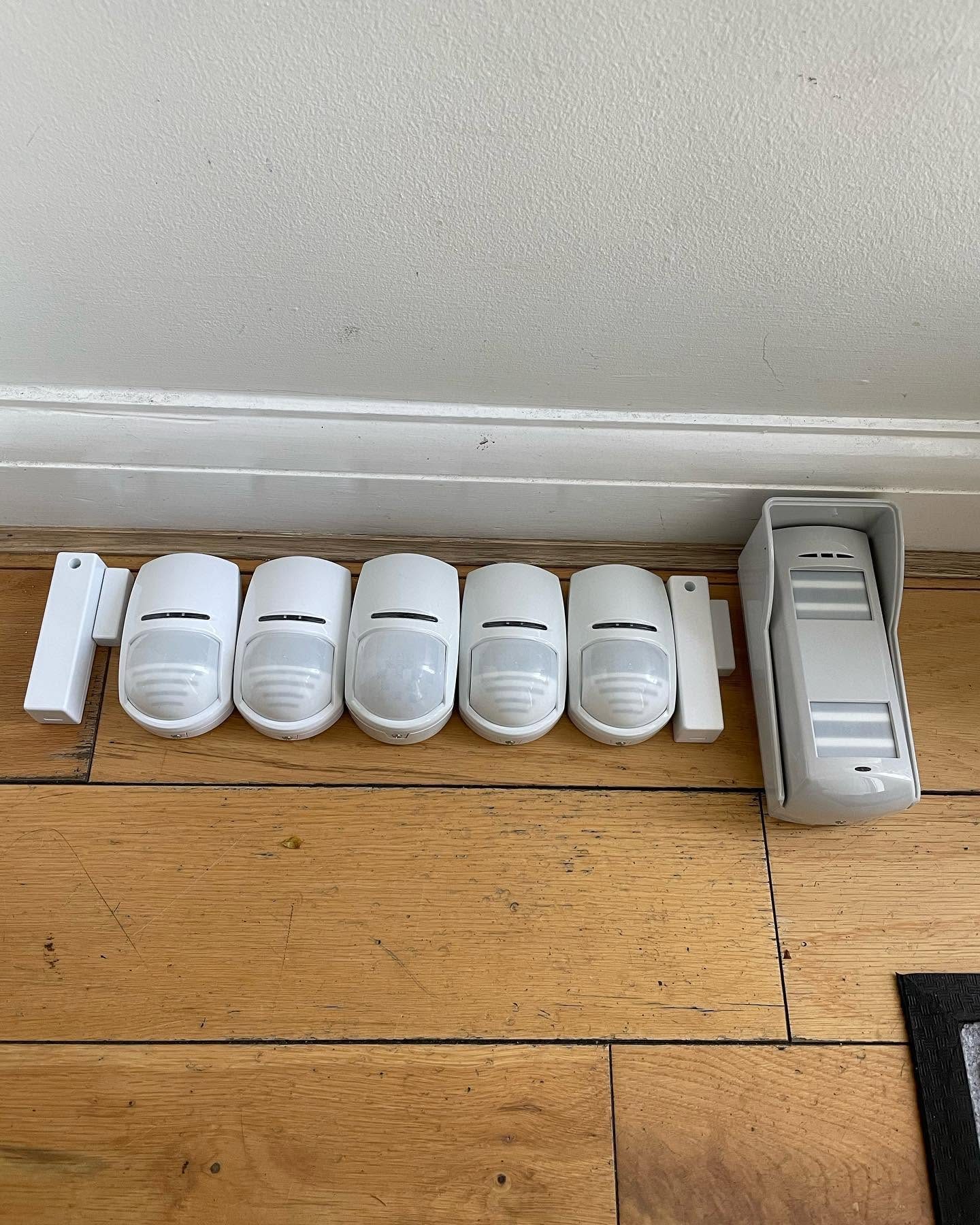Wireless intruder alarm motion sensors and control device ready for installation