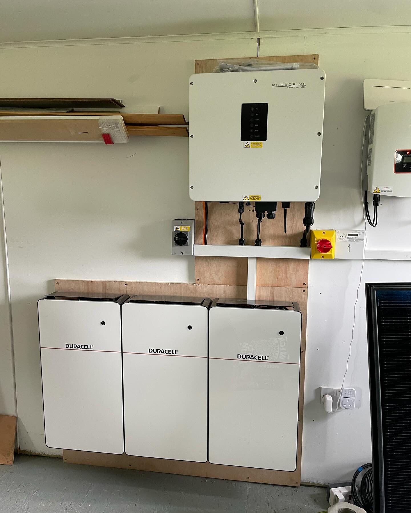 Duracell inverter with three wall-mounted battery modules and isolators fitted by Pro-Detect
